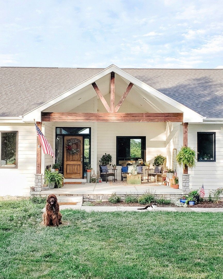 White ranch farmhouse Wood beams Front porch Summer decor Newfoundland ...